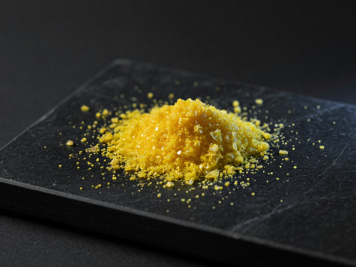A vivid pile of intensely yellow-gold berberine powder.