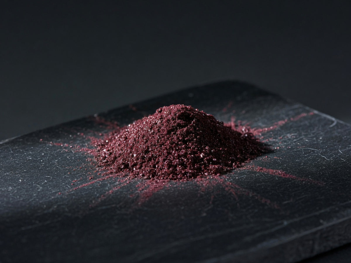 A small mound of deep maroon chromium picolinate powder.