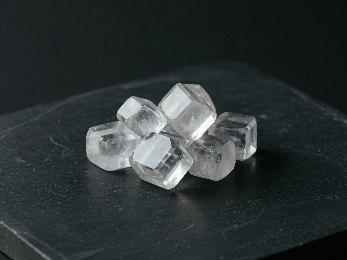 A cluster of clear cubic crystals with sharp faces.