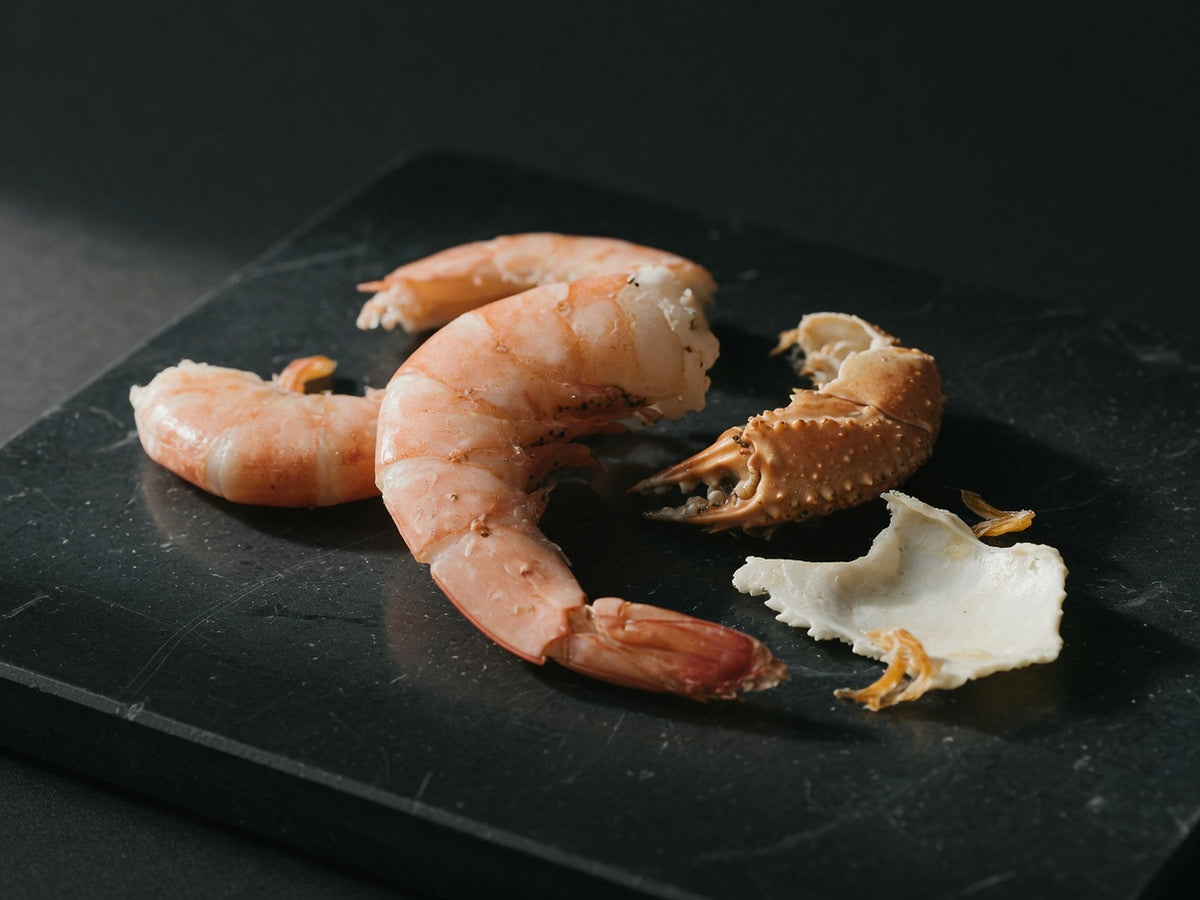 Curved pink-amber shrimp and crab shells, the source of glucosamine.