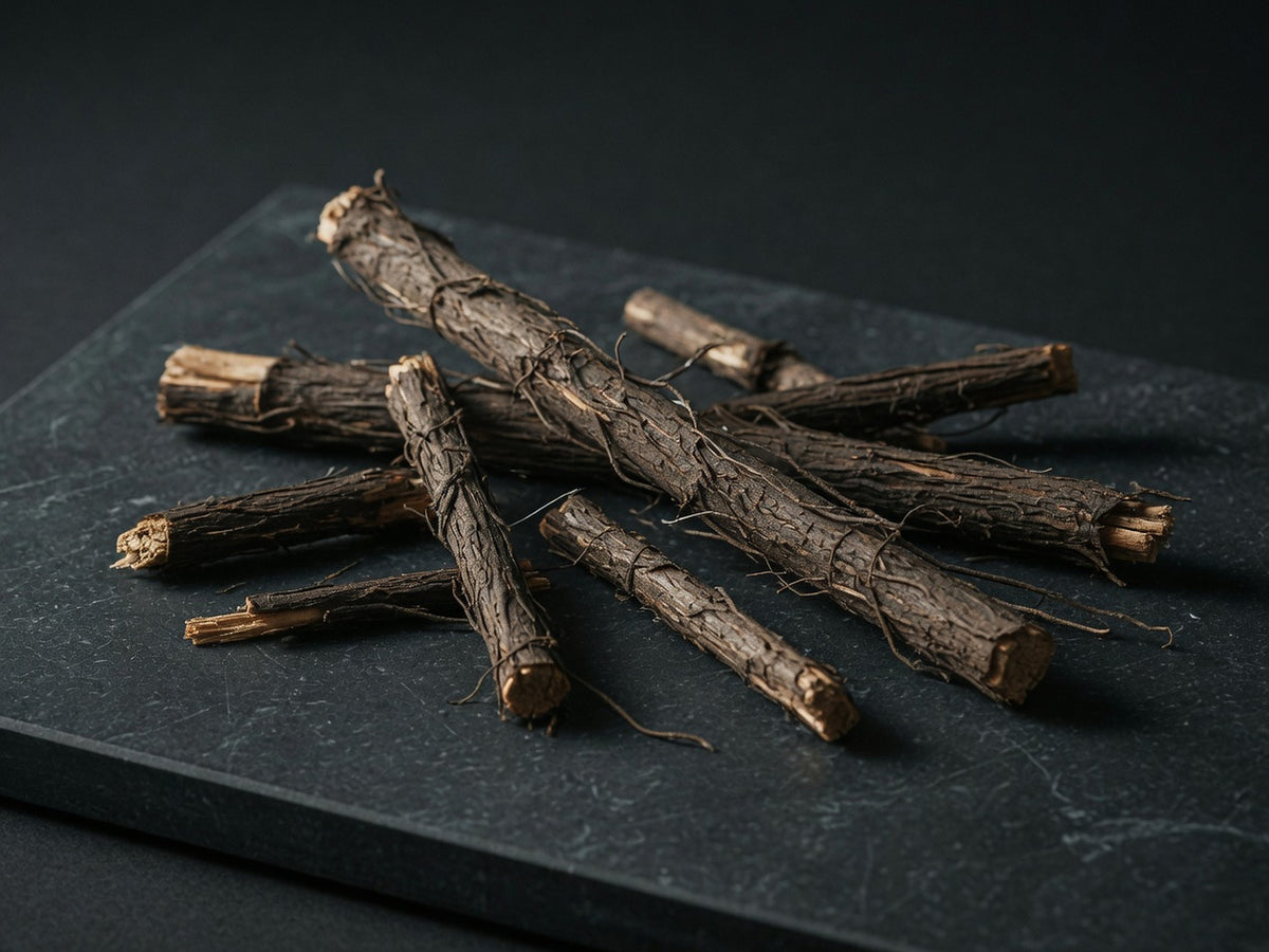 Slender dark-brown tongkat ali roots, dry and fibrous.